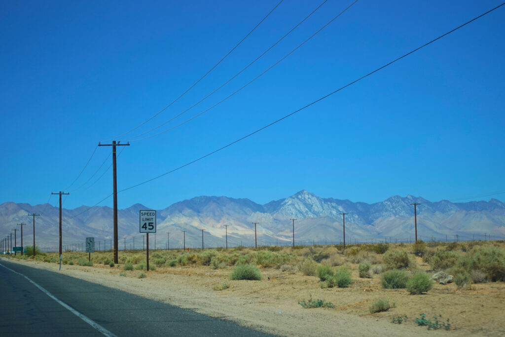 Highway with mountains in the background.